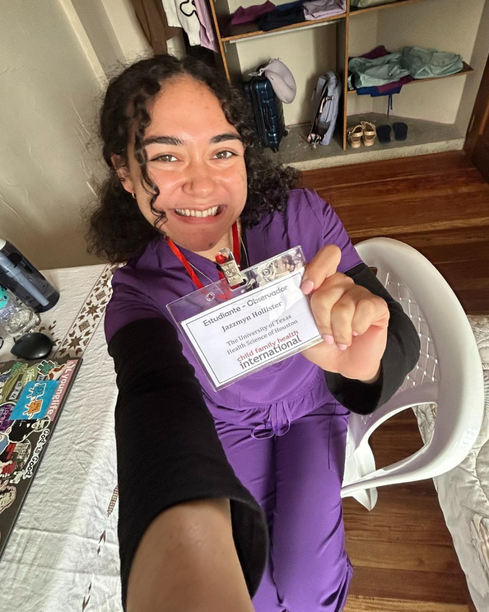 Jazzmyn Hollister in purple scrubs with student badge.